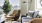 a living room with a couch and a lamp