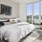 a bedroom with a large window