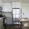 a kitchen with white cabinets