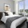 a bedroom with a large window