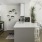 a kitchen with a table and chairs