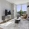 a living room with a tv and furniture