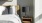 a bedroom with a bed and a lamp