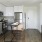 a kitchen with white cabinets
