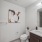 bathroom with a large mirror and sink