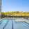 swimming pool with lounge chairs and umbrellas