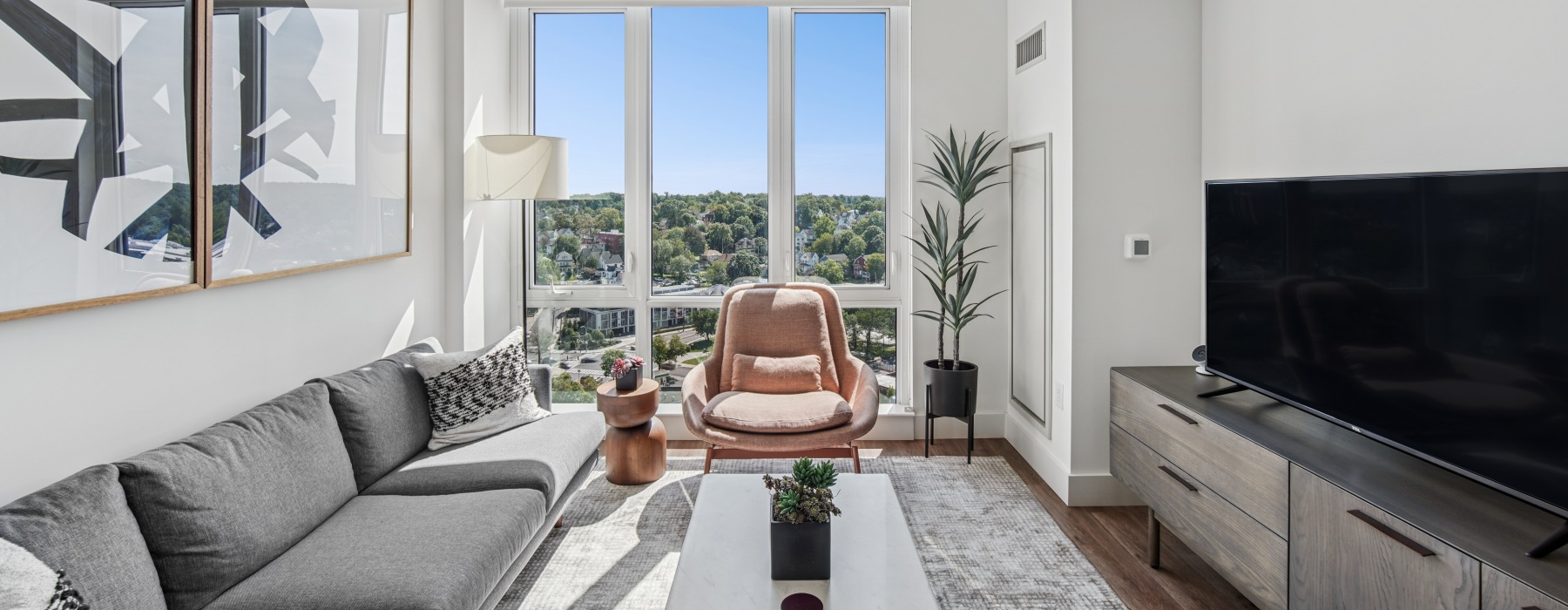 living room with floor to ceiling windows 