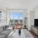 living room with a couch and coffee table in front of a tv