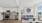 kitchen and living area with floor-to-ceiling windows and decorations