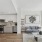 kitchen and living area with floor-to-ceiling windows and decorations