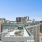 a building in a city with a rooftop deck